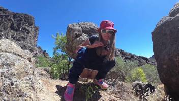 PISS PISS TRAVEL - Young girl tourist peeing in the mountains Gran Canaria. Public Canarias